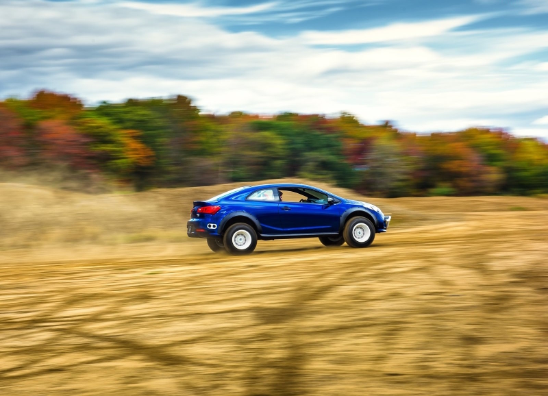 Illustration for article titled The Kia Forte Koup Mud Bogger Concept Is Badass Even If It's Two-Wheel Drive